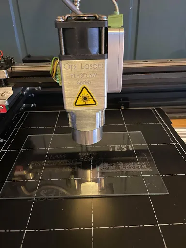 Laser Engraving Glass with Black Metal Sheet